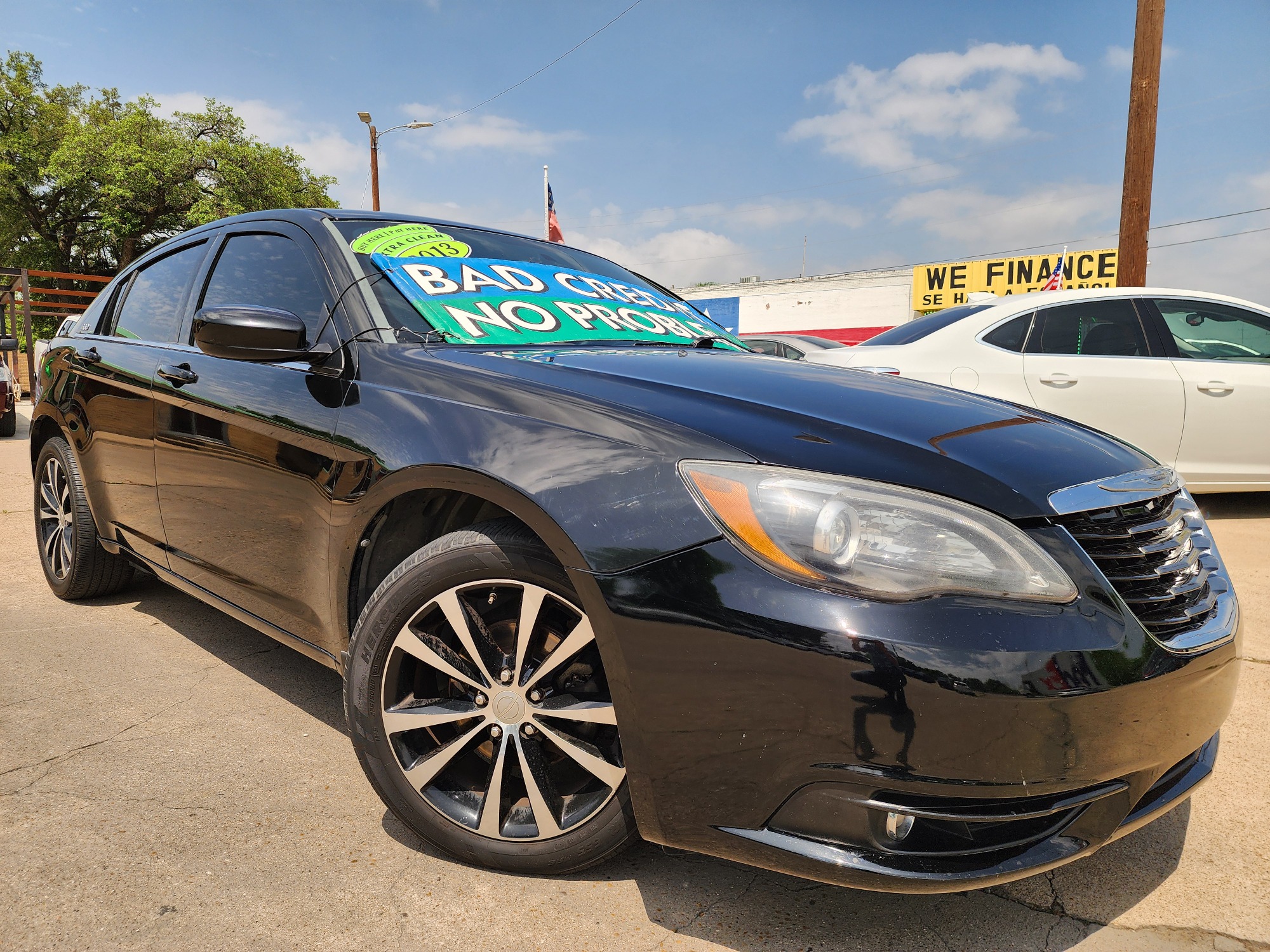 2013 BLACK Chrysler 200 Touring (1C3CCBBB2DN) with an 2.4L L4 DOHC 16V engine, 6-Speed Automatic transmission, located at 2660 S.Garland Avenue, Garland, TX, 75041, (469) 298-3118, 32.885387, -96.656776 - Welcome to DallasAutos4Less, one of the Premier BUY HERE PAY HERE Dealers in the North Dallas Area. We specialize in financing to people with NO CREDIT or BAD CREDIT. We need proof of income, proof of residence, and a ID. Come buy your new car from us today!! This is a very well cared for 2013 Ch - Photo #0